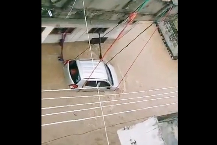 Man ties car with ropes in flood-hit Telangana town