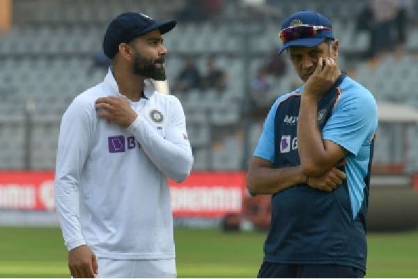 Injured Virat Kohli receives throwdowns from Rahul Dravid