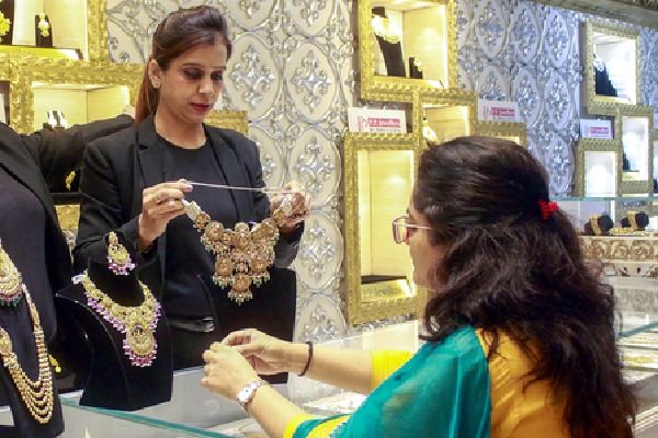 Gold falls marginally, silver prices jump