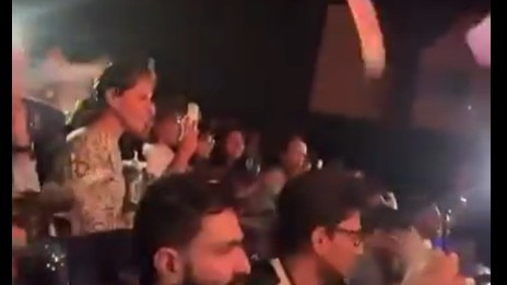 Upasana whistles throws papers during Ram Charans Peddi show
