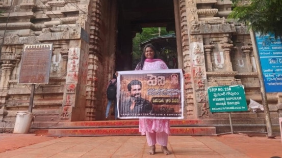 Young woman displays Peddi poster on Tirupati Alipiri path drawing severe criticism