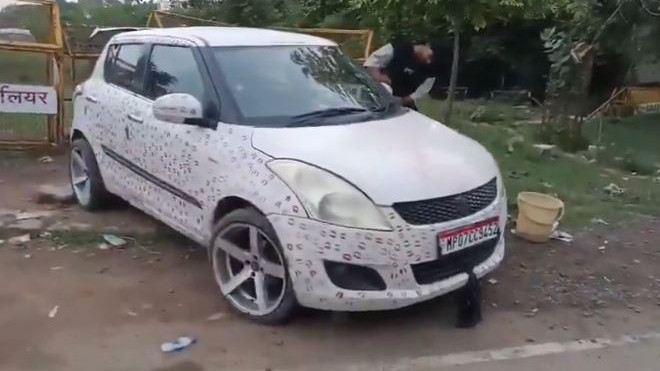 Aditya Sikarwar car with 3400 lipstick kisses leads to police action and fine