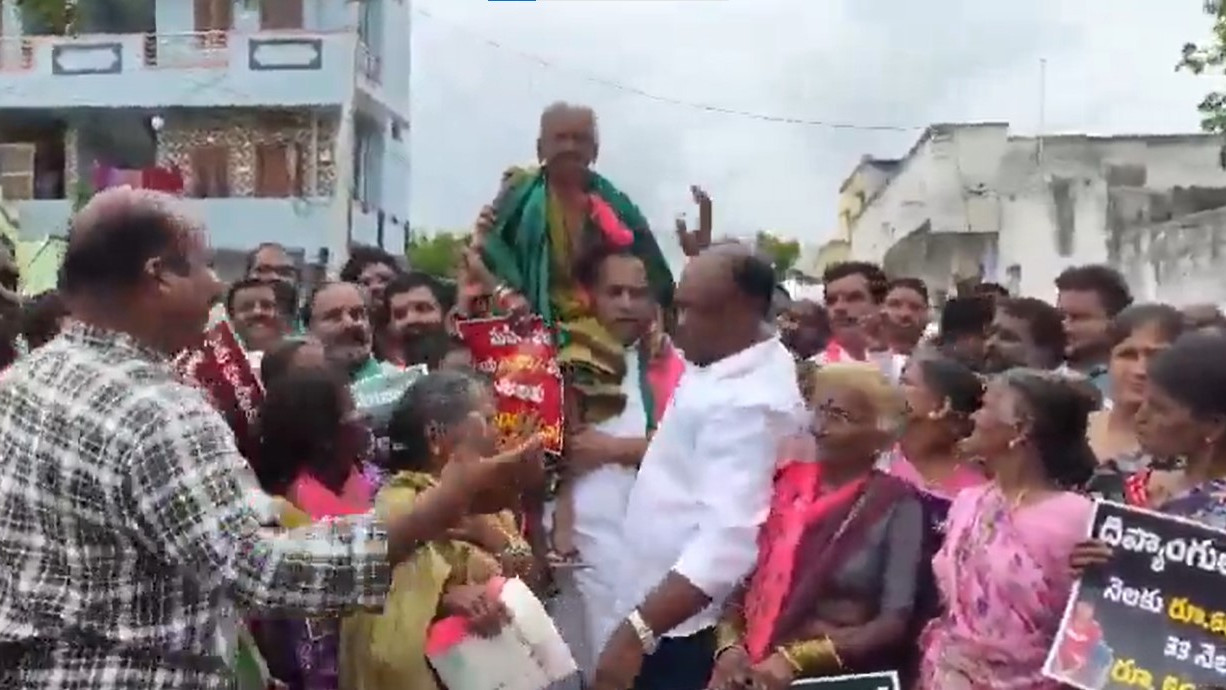 Malla Reddy dances with elderly woman on his shoulders viral video
