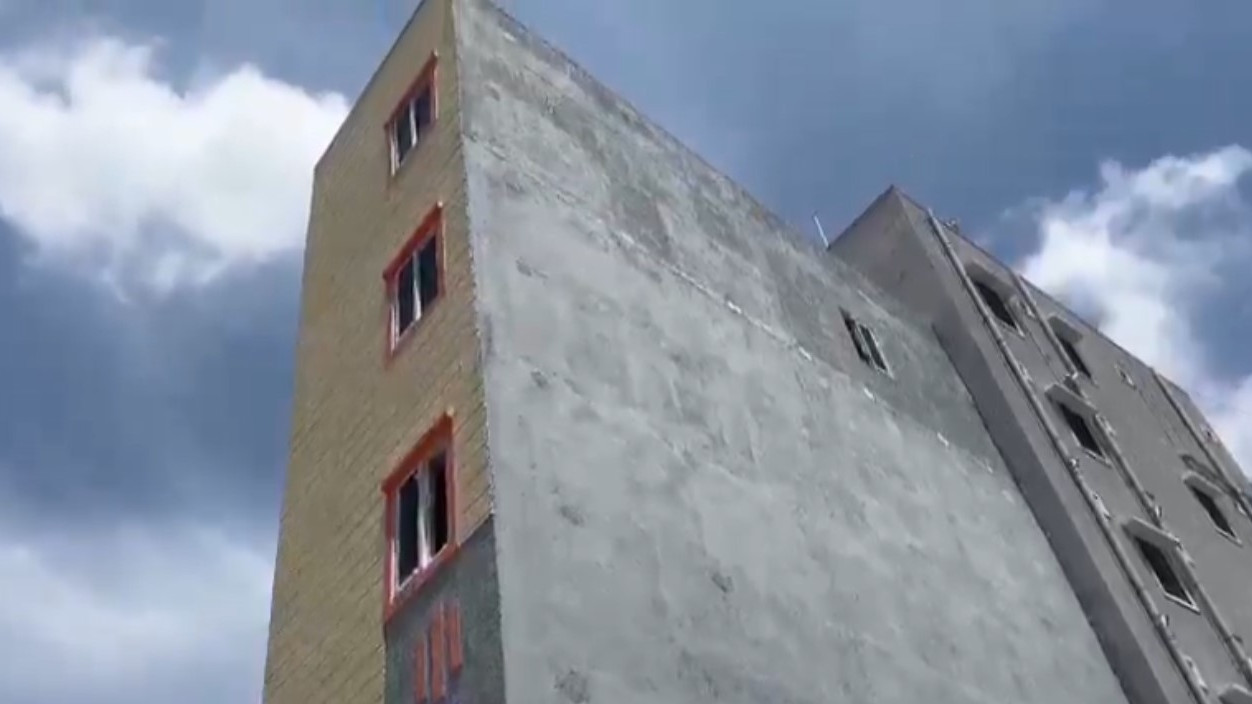 Hyderabad tilted building demolition starts with Bahubali crane in Gopanpally