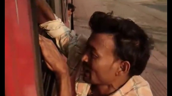 Phone thief gets shocking treatment as he hangs to a moving train