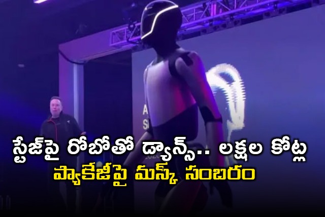 Elon Musk dances with robot after shareholders approve package