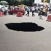 Heavy Pit Hole Middle Of The Road Under Fly Over