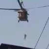 Taliban helicopter raid with hanging a human body