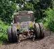 Nadendla shares some photos of a bus which lost its back tyres on a ugly road