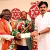 Pawan Kalyan handed cash cheque to Kinnera artist Mogulaiah