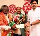 Pawan Kalyan handed cash cheque to Kinnera artist Mogulaiah