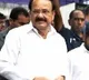 Venkaiah Naidu plays badminton at Chennai sports institute