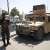 Taliban fighters force men into car boots