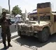Taliban fighters force men into car boots