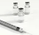 nurse administers corona vaccine two times to an old lady