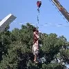 Taliban hangs dead body to a crane