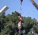 Taliban hangs dead body to a crane