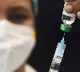 US pushes on with Covid vax plan as booster shot approved