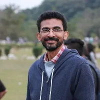Sekhar Kammula helps a farmer