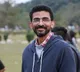 Sekhar Kammula helps a farmer