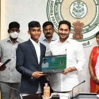 CM Jagan presents laptops to SC and ST IIT rankers