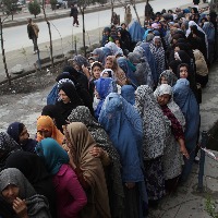 Under Taliban regime poor Afghan women beg at bakeries to feed children