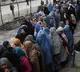 Under Taliban regime poor Afghan women beg at bakeries to feed children