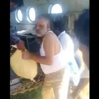 Chevireddy unloads bags of essentials from a navy chopper
