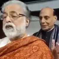 Rajnath Singh pats on TMC MP Sudip Bandyopadhyays shoulder