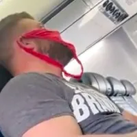 Man wears woman underware as mask in america flight