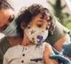 parents taking kids to abroad for covid vaccination