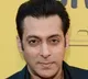 Salman Khan drives an auto-rickshaw on a busy street
