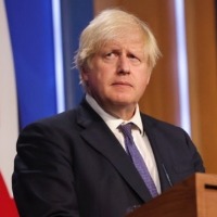 UK PM plans to 'ride out' Omicron wave with no more curbs