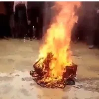Taliban set to fire music instrument in front of musician