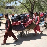 Over a million Afghans flee to Iran as economy collapses
