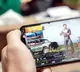 young man who has lost mental balance to a smartphone
