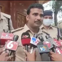 Male tailor takes measurements of Nellore district women cops