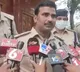 Male tailor takes measurements of Nellore district women cops