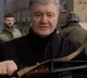 Ukraine former president Petro Poroshenko holds gun to fight against Russian forces