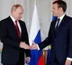 France president Macron talks to Putin