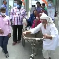 Azamgarh An elderly person reaches polling booth by pulling a cart