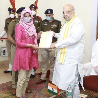 Shah hands over appointment letters to kin of martyred J&K cops
