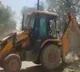 Policemen park bulldozer near house absconding rapist surrenders