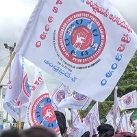 Andhra employees tonsure heads, beat themselves with footwear