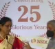 Nirmala Sitharaman gives drinking water to NSDL MD Padmaja Chunduru on stage