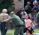 Cops waited outside classroom as students begged for help