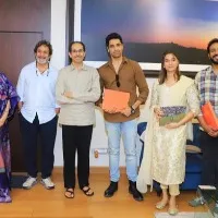 Maharashtra CM Udhav Thackeray gifts a book to Adivi Sesh