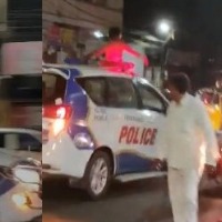 Drunk man hops on to moving police vehicle in Hyderabad