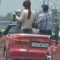 Groom dances takes selfies in moving open roof Audi in UP