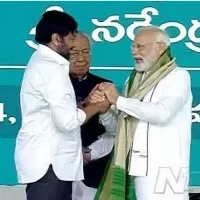 pm modi encourages chiru on stage at bhimavaram